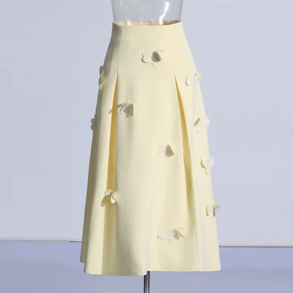 Elegant yellow midi skirt with a flared design and vertical pleats.