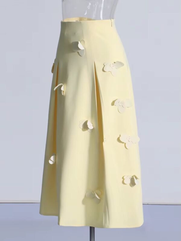 Elegant yellow midi skirt with a flared design and vertical pleats.